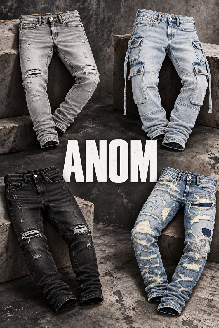 ANOM streetwear jeans poster featuring distressed denim, exterior pocket panels and frayed patchwork jeans on charcoal concrete
