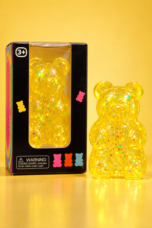 Yellow glitter gummy bear squishy with window box; AI assisted product image