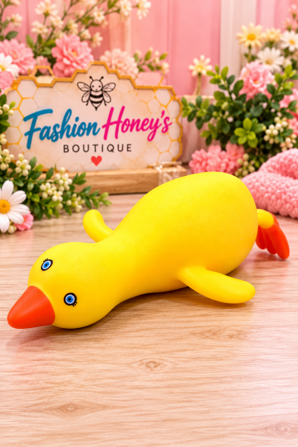 Yellow crunchy duck squishy orange beak blue eyes and tail boutique display