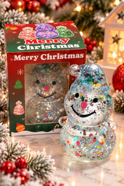 Christmas glitter snowman sugar squeezy beside illustrated Merry Christmas packaging