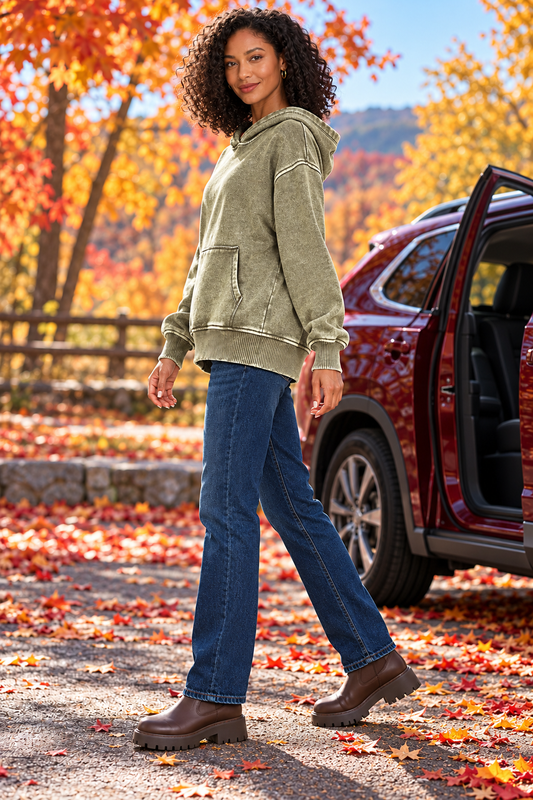 Zenana Dark Olive acid wash hoodie left three-quarter view outdoors in autumn