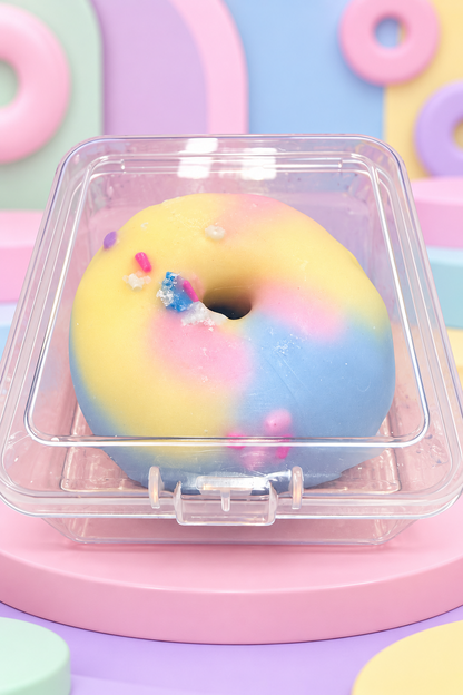 Yellow, pink and blue Crispy Balls Donut in a clear container