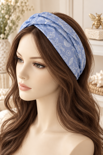 Periwinkle Shell Outline scarf headband displayed broadly on a mannequin with long hair