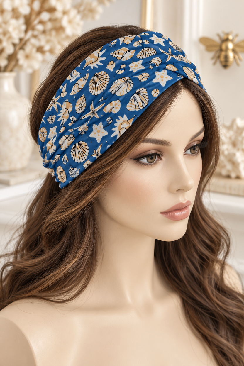 Ocean Blue & Gold Shells scarf headband displayed broadly on a mannequin with long hair