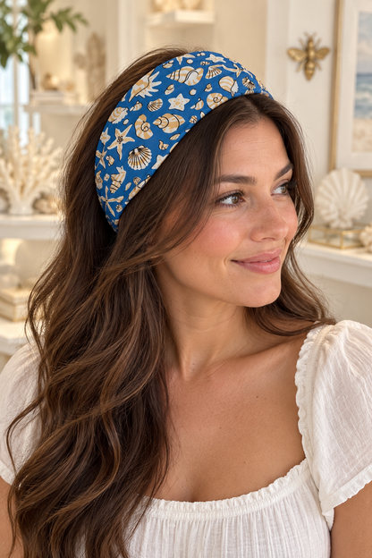 Long-haired model wearing the Ocean Blue & Gold Shells wide scarf headband