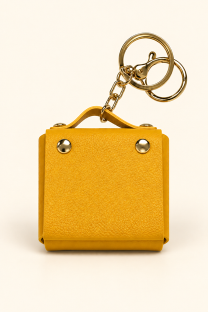 Yellow mini coin purse keychain with gold-tone hardware