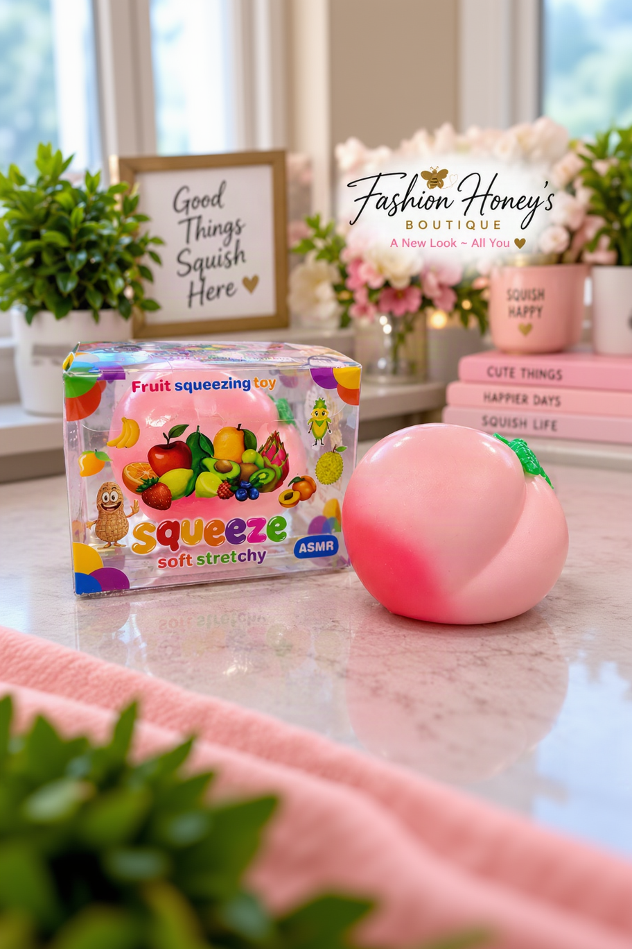 Pink peach fruit squishy with original package in a professional Fashion Honey's setting