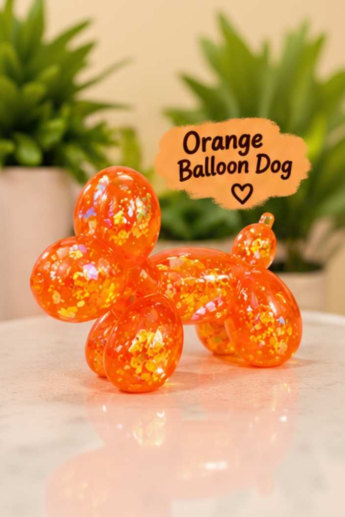 Orange glitter-filled Cube Squeeze balloon dog squishy toy