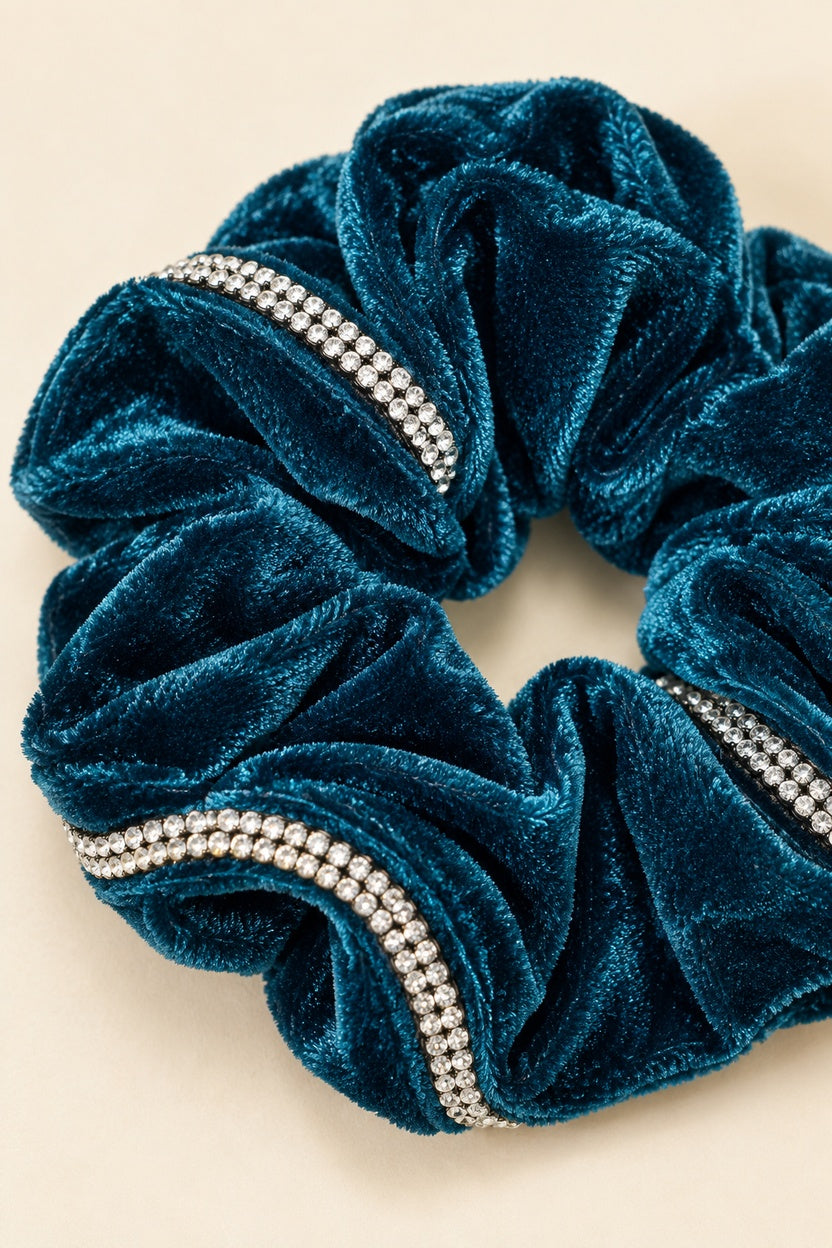 Close-up of continuous double-row rhinestone trim and Teal velvet folds