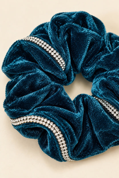 Close-up of continuous double-row rhinestone trim and Teal velvet folds
