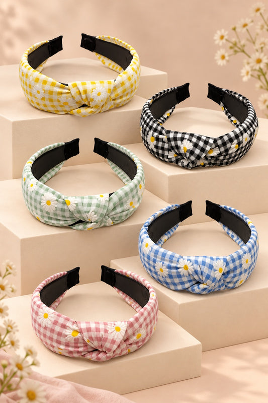 Five Ellas daisy gingham top-knot headbands in yellow, black, mint green, blue and pink on cream boutique display tiers