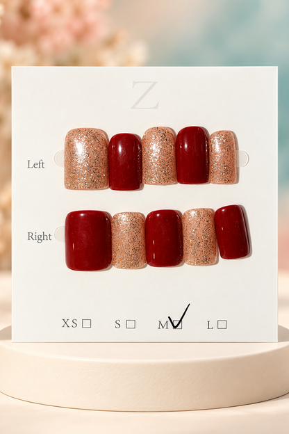 Original manufacturer card and burgundy rose gold glitter nail set displayed without wrapper on cream plinth