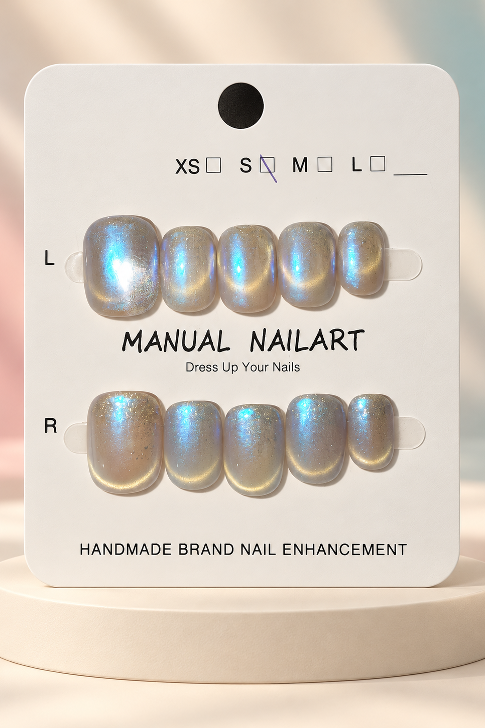 Silver Blue Iridescent Press-On / Glue-On Nails – Squoval Size S; original manufacturer card displayed without outer wrapper on a cream studio plinth