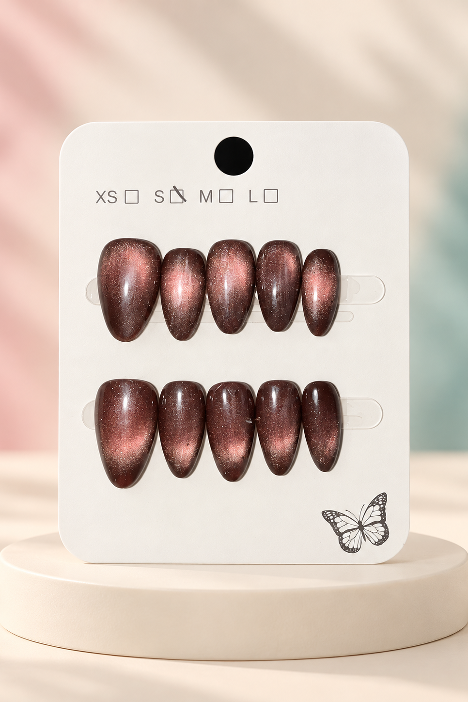 Smoky Bronze Cat-Eye Press-On / Glue-On Nails – Almond Size S; original manufacturer card displayed without outer wrapper on a cream studio plinth
