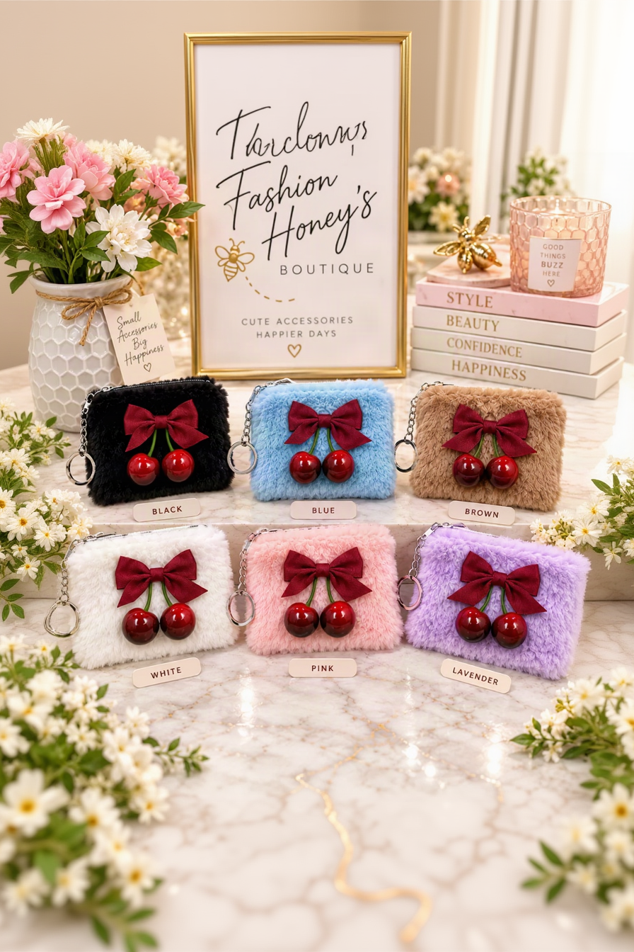 Six fuzzy cherry pouch keychain colors arranged in two uniform rows