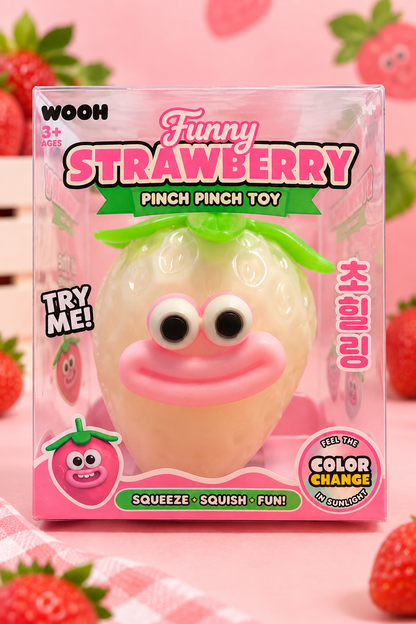 Funny Strawberry Pinch Pinch Toy in clear retail box packaging