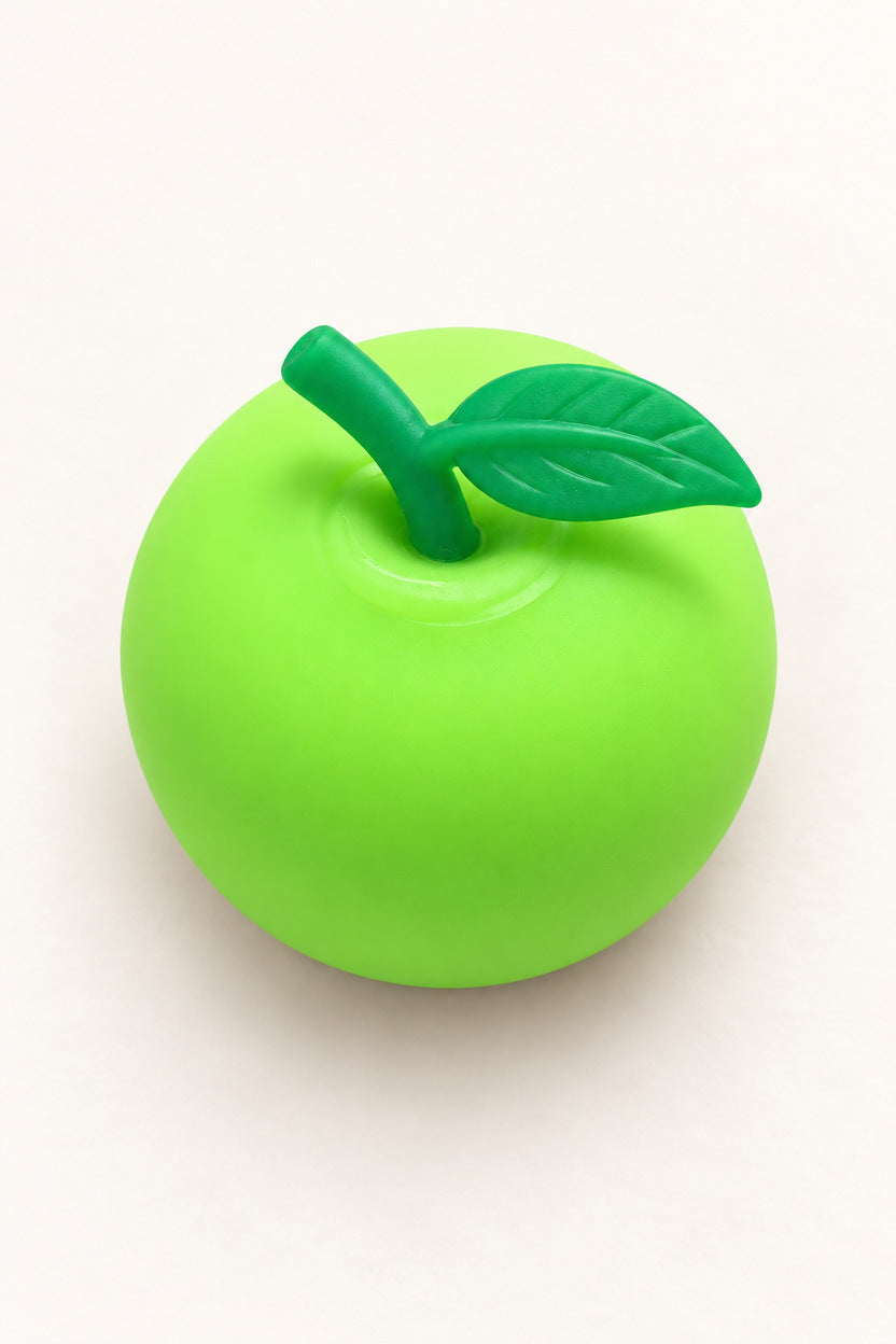 Top detail of darker green leaf and stem on lime green apple squishy