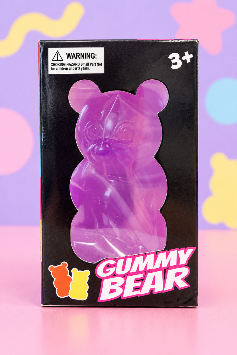 Purple Gummy Bear squishy toy in its black window box, ages 3 and up