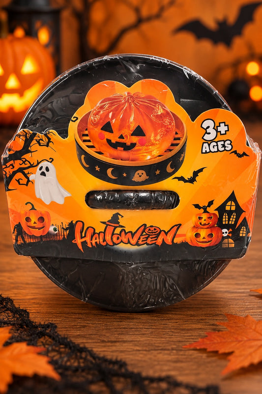 Halloween pumpkin dumpling mystery glitter squishy in sealed black steamer-style package