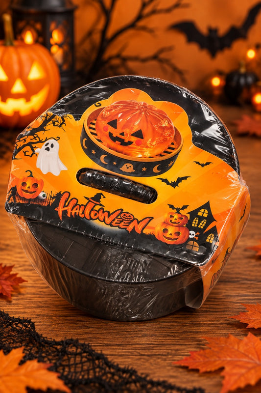 Sealed Halloween pumpkin dumpling squishy package on a spooky seasonal background