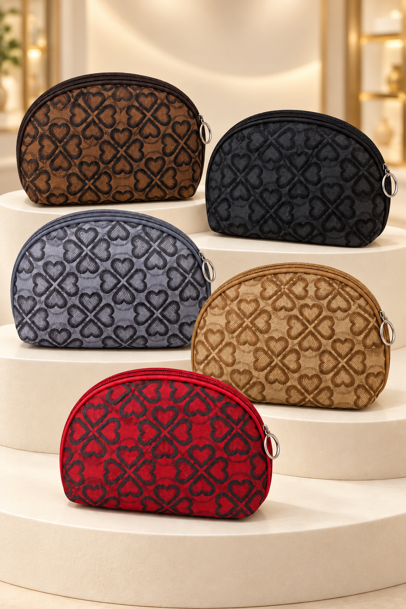 Five heart-pattern makeup bag colors on cream boutique display risers; one selected bag per purchase