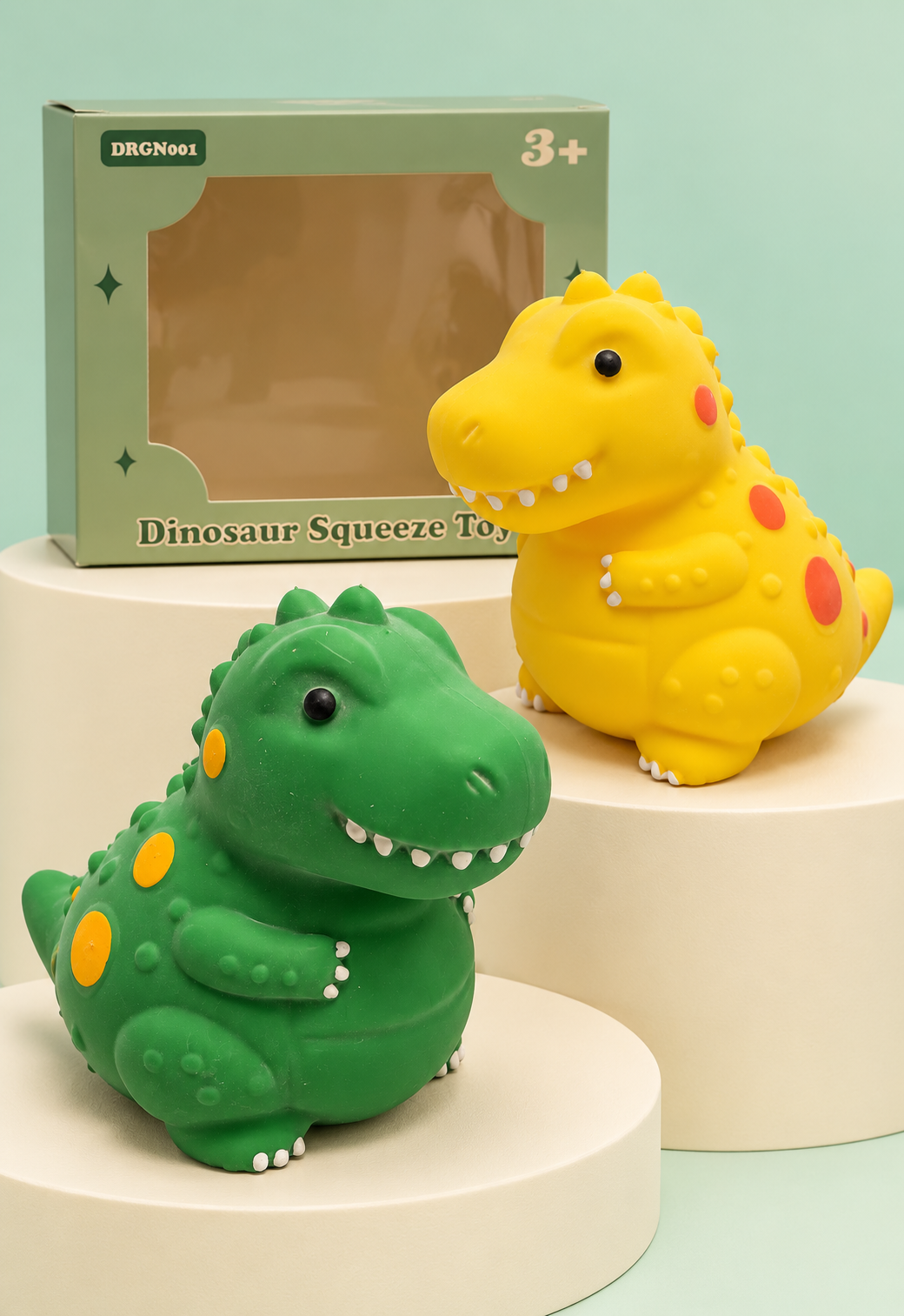 Yellow and green jumbo dinosaur squishies on tiers with original box
