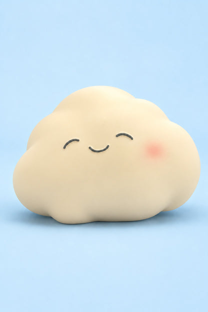One jumbo cream smiling cloud squishy on a pale blue background, unpackaged