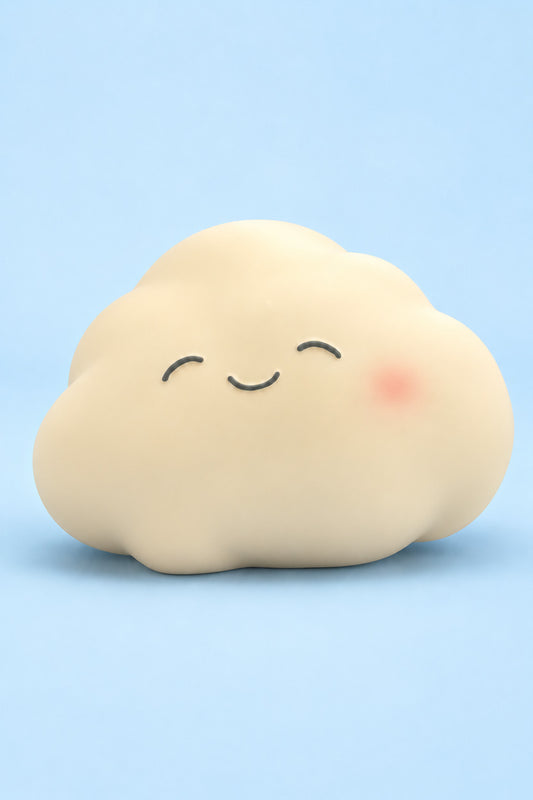 One jumbo cream smiling cloud squishy on a pale blue background, unpackaged