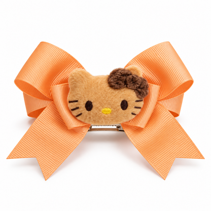 Peach ribbon bow hair clip with tan plush kitty face