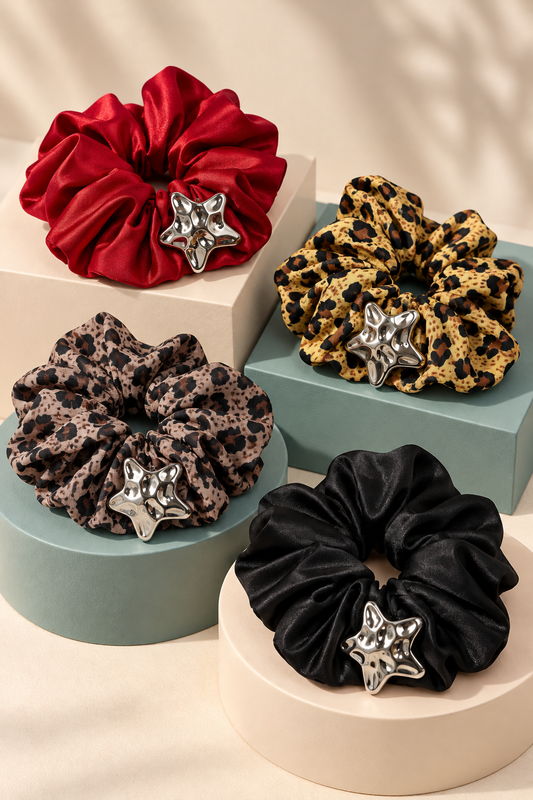 Four Melody star-accent scrunchies in Black, Red, Taupe Leopard and Gold Leopard