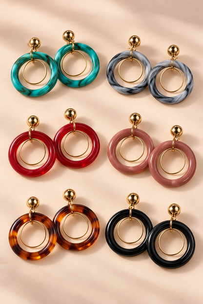 Six color pairs of MINT double hoop earrings with gold-tone inner hoops and round studs