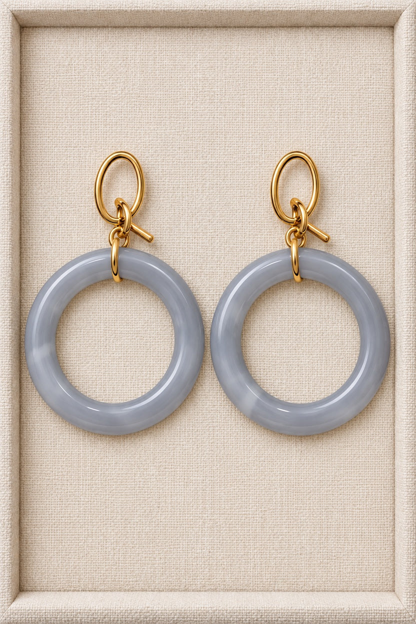 Gray MINT earrings with single round plastic hoops and gold-tone oval fronts
