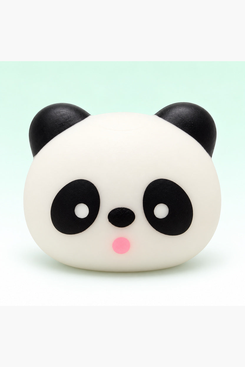 Three-inch black and white panda head squishy on a mint background