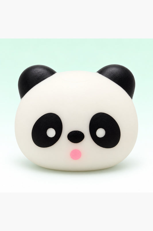 Three-inch black and white panda head squishy on a mint background