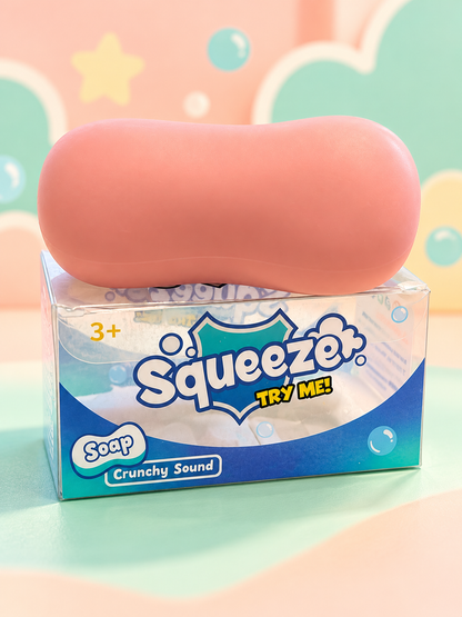 Pink crunchy soap squishy on its original retail box