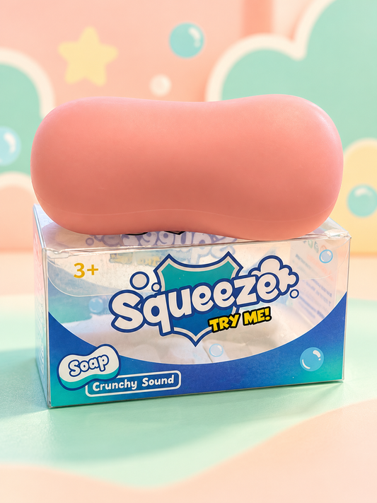 Pink crunchy soap squishy on its original retail box