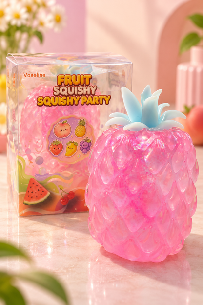 Pink pineapple glitter Vaseline-style squishy beside original retail package