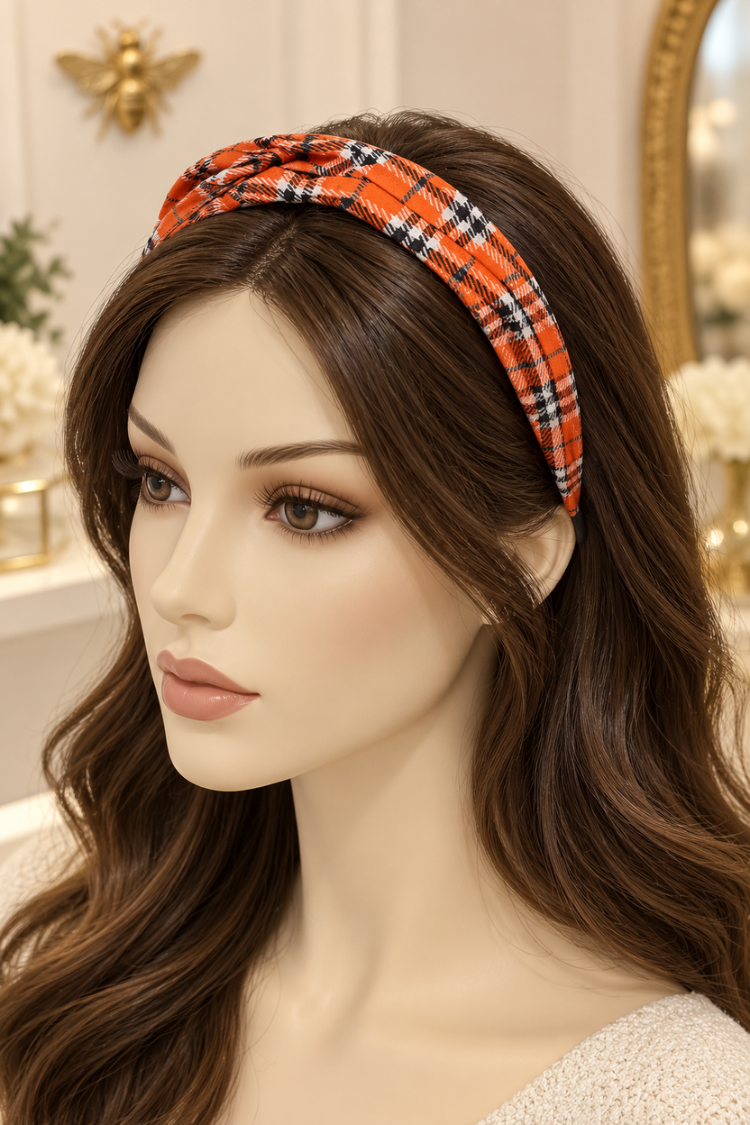 Orange plaid top-knot headband displayed on a long-haired mannequin