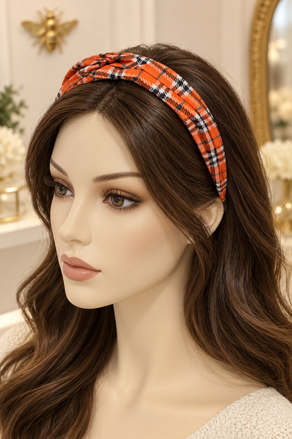 Orange plaid top-knot headband displayed on a long-haired mannequin