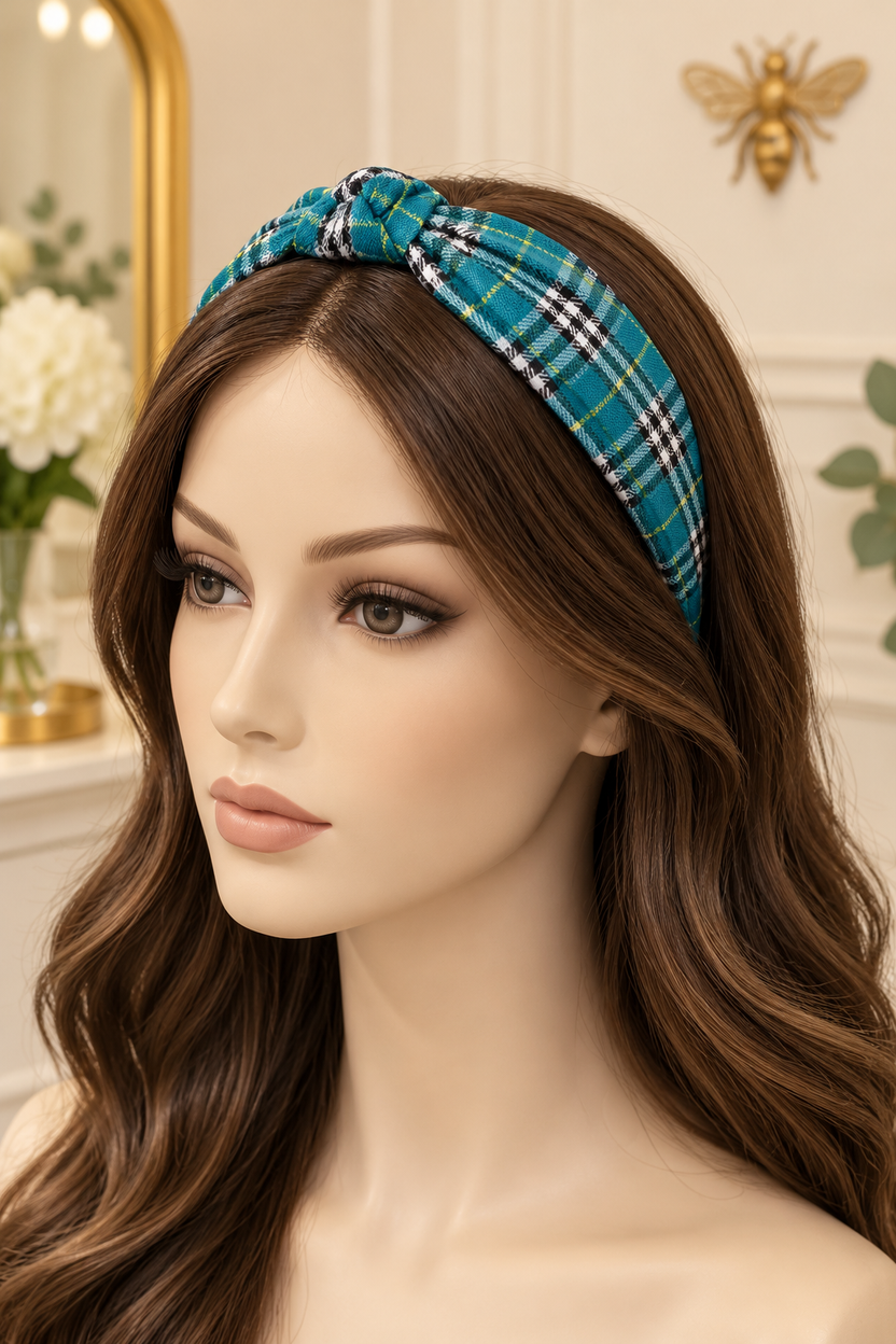 Teal plaid top-knot headband displayed on a long-haired mannequin