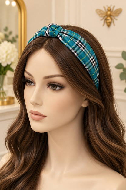 Teal plaid top-knot headband displayed on a long-haired mannequin