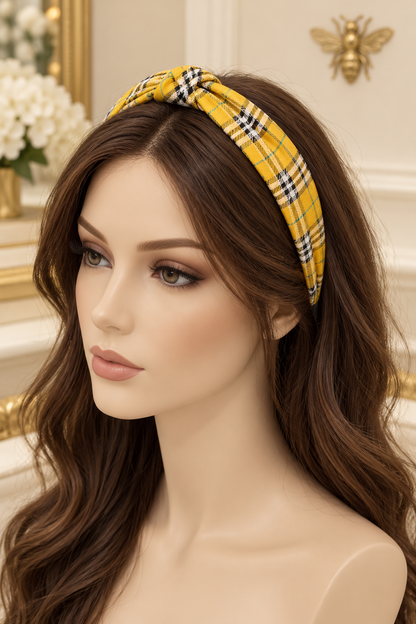 Yellow plaid top-knot headband displayed on a long-haired mannequin