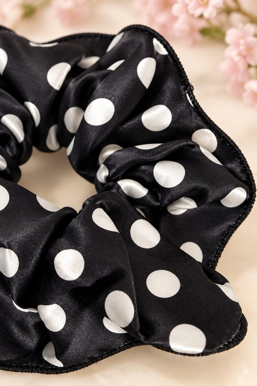 Close-up of Black/White polka-dot scrunchie fabric gathers and black stitched edging
