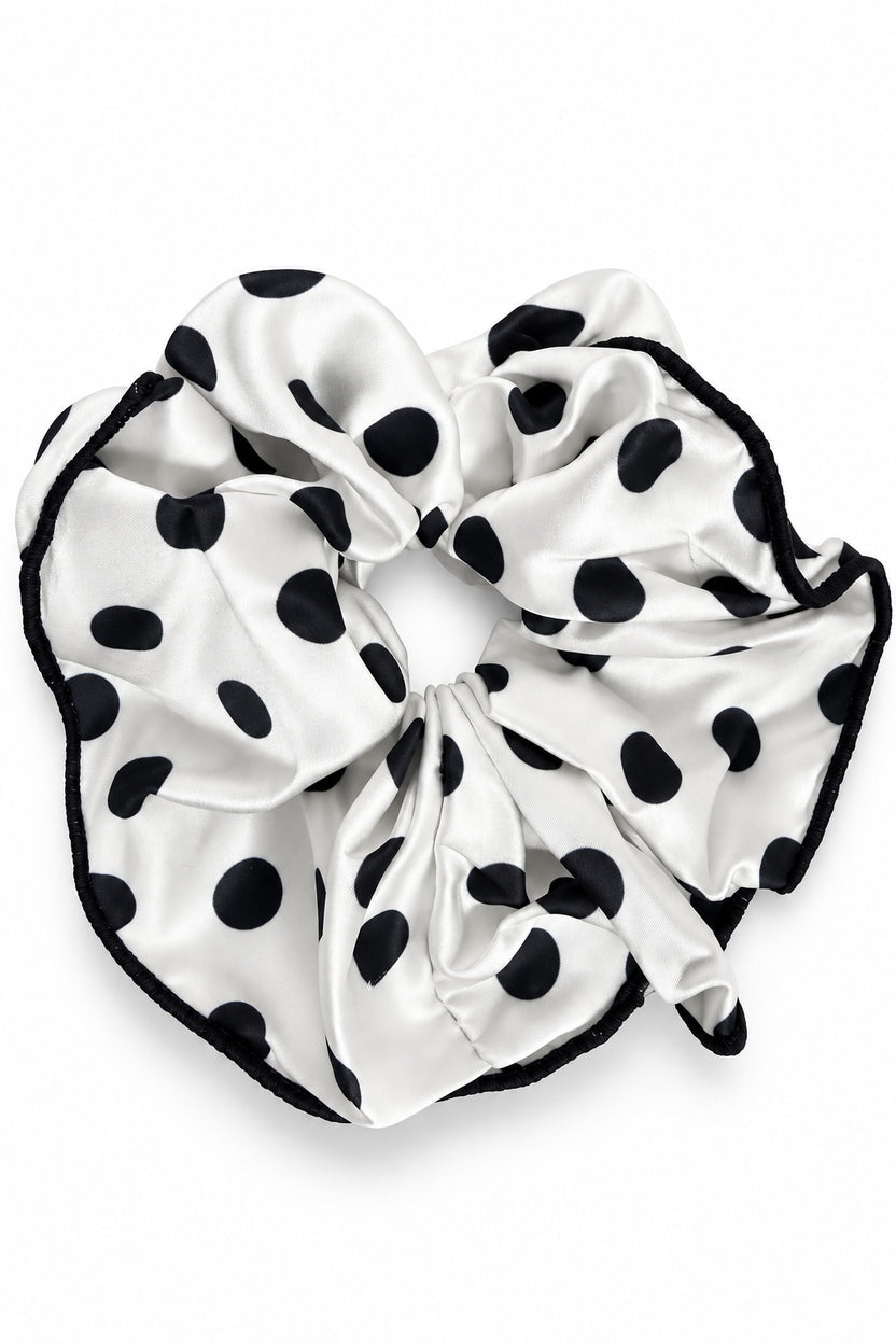 Ellas White/Black ruffle scrunchie with black polka dots on white fabric