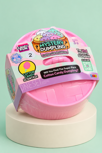 Three-quarter view of sealed pink RMS Cotton Candy Edition Series 2 steamer on a cream display pedestal.