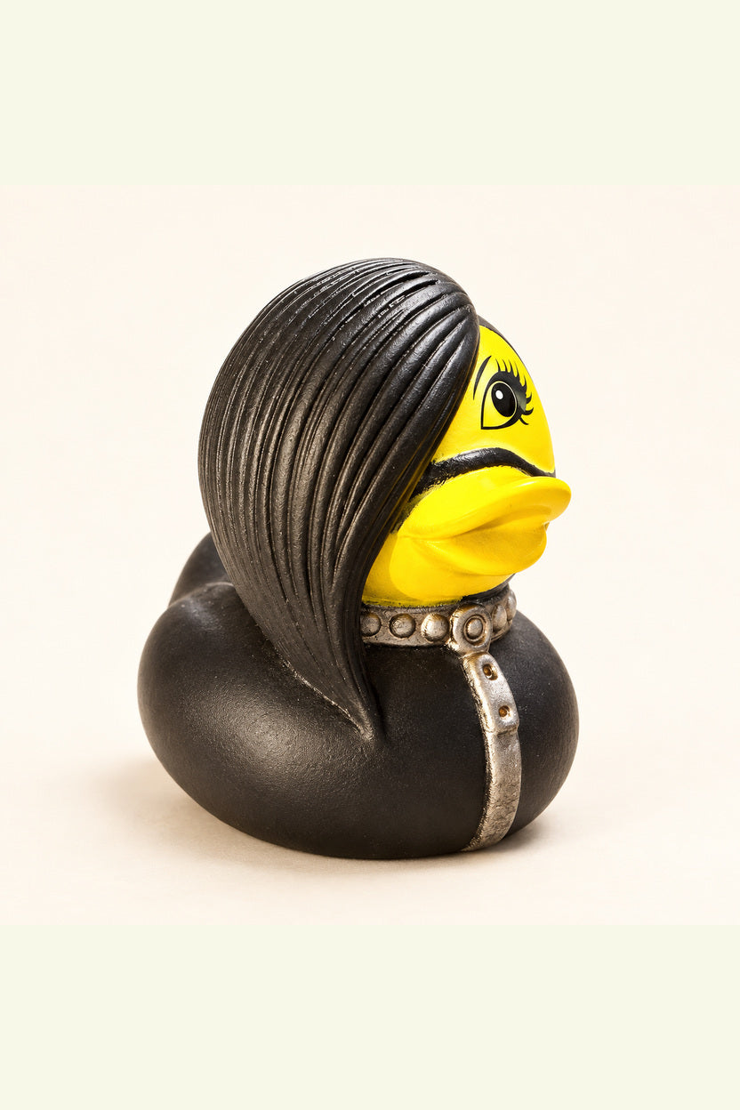 Roxy rubber duck with black side swept hair, yellow face and silver studded collar on ivory background