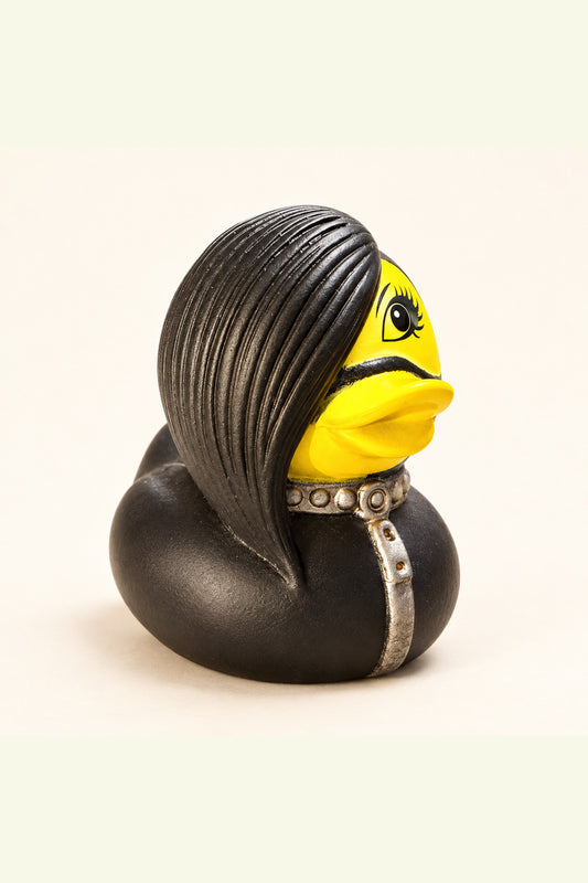 Roxy rubber duck with black side swept hair, yellow face and silver studded collar on ivory background