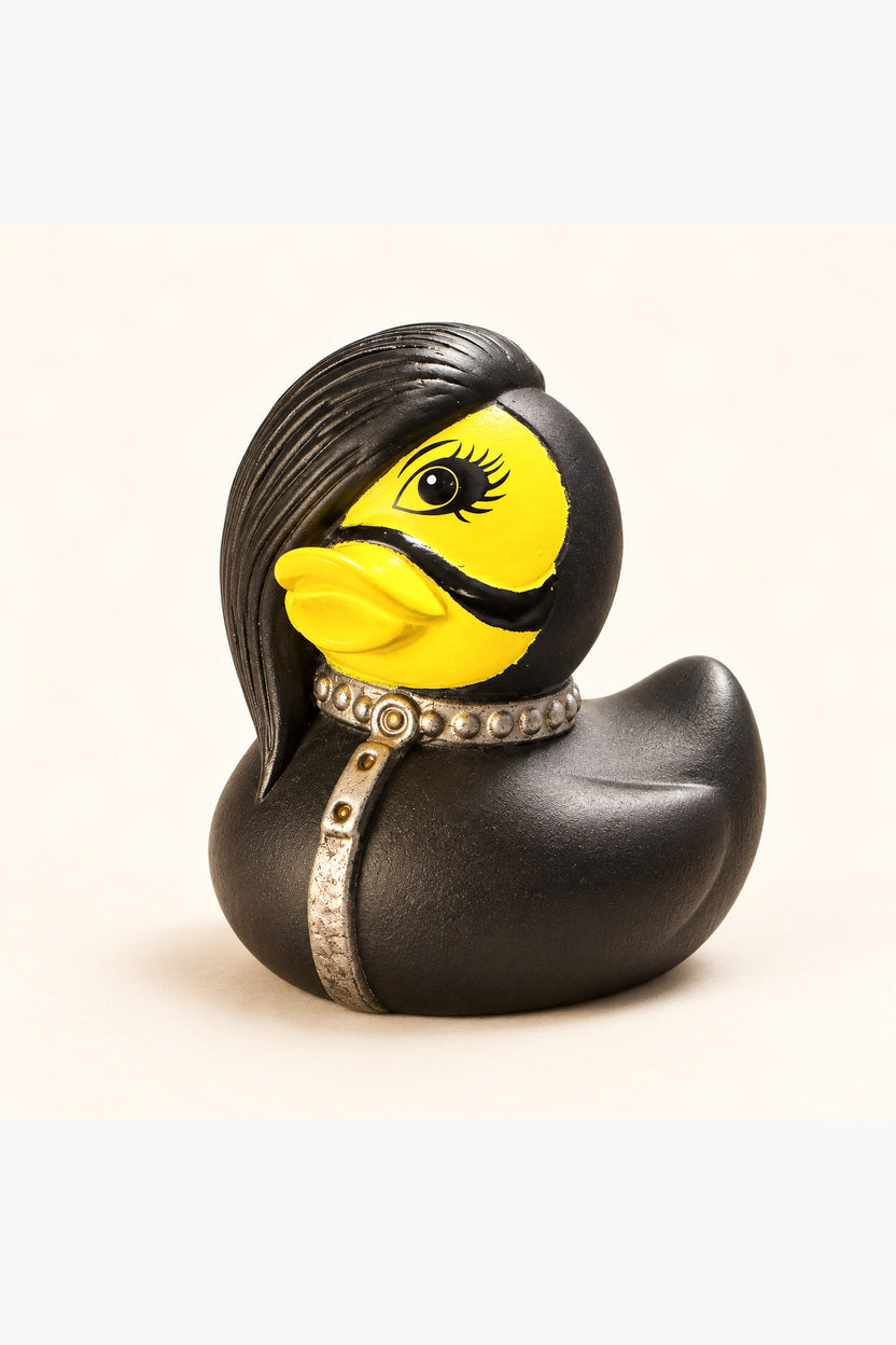 Roxy duck side view showing black side swept hair and silver studded collar