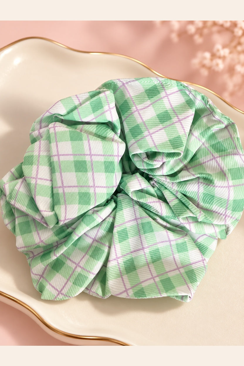 Mint green plaid scrunchie fabric and gathered elastic close-up