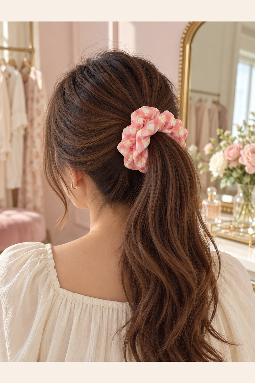 Pink pastel plaid scrunchie worn in a ponytail